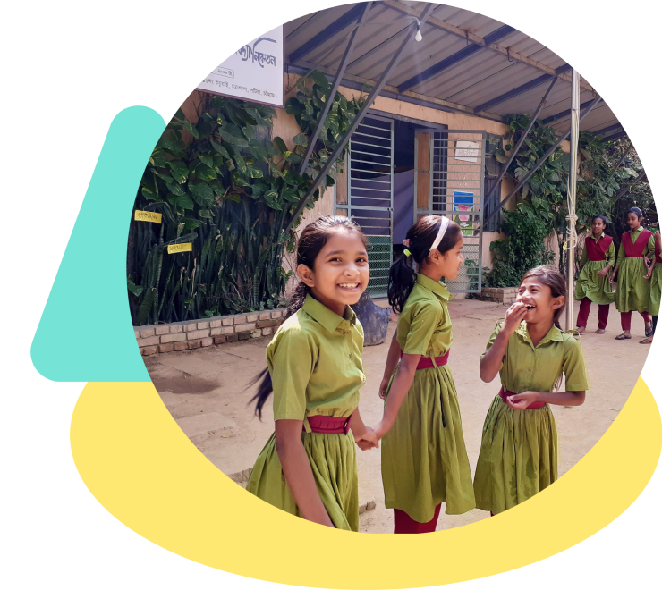 School children in green uniforms running together